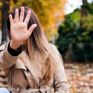 woman hiding her face